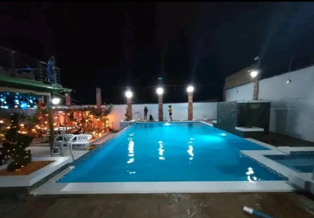 Night-lit pool with feature lighting